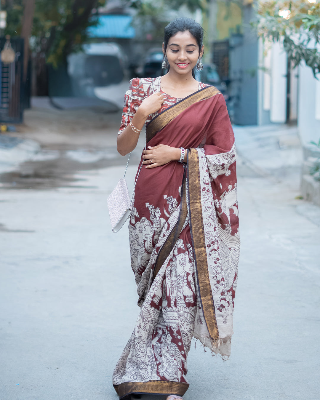 Maroon Kalamkari silk saree with Nizam border