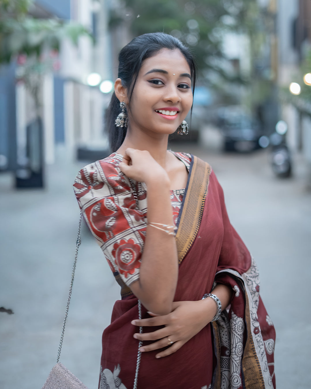 Maroon Kalamkari silk saree with Nizam border